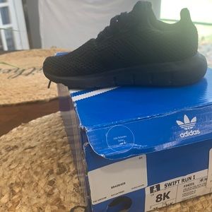 Adidas toddler tennis shoe.  Size 8 barely worn.